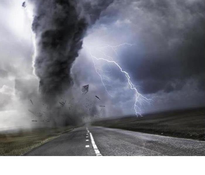 Lightning in sky with tornado funnel